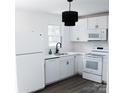 White kitchen featuring modern appliances and plenty of cabinet space at 412 E Taylor St, Landis, NC 28088