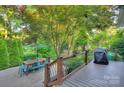 An inviting outdoor dining space on a wooden deck, perfect for entertaining guests at 4831 Antioch Church Rd, Matthews, NC 28104