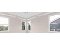 Bright bedroom with multiple windows providing natural light and views of the outdoors at 1074 Wylie Falls Ln, York, SC 29745