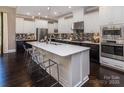 Gourmet kitchen with large island, stainless appliances, pendant lighting, and breakfast bar seating at 1074 Wylie Falls Ln, York, SC 29745