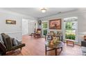 Comfortable living room with hardwood floors, natural light, and elegant furnishings at 1109 Sunnyview Cir, Matthews, NC 28105