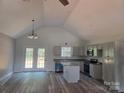 Bright, open kitchen featuring stainless steel appliances and an island at 153 Brook Creek Dr, Troutman, NC 28166