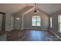 Spacious living room with vaulted ceilings and large windows at 153 Brook Creek Dr, Troutman, NC 28166