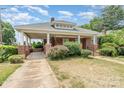 Inviting brick home featuring a covered parking area and traditional architectural details at 330 S Ellis St, Salisbury, NC 28144