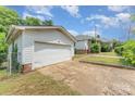 Detached white garage with ample space and a view of the main house at 330 S Ellis St, Salisbury, NC 28144