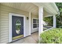 Inviting front porch with decorative door, house number and a cozy entrance setting at 3333 Cole Mill Rd, Charlotte, NC 28270