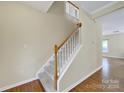An entry staircase with wood-look floors and neutral walls at 3333 Cole Mill Rd, Charlotte, NC 28270