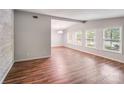 Bright living room with wood floors, neutral paint, and lots of natural light at 6513 Old Post Rd, Charlotte, NC 28212