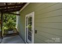 Inviting porch with room for a porch swing and seating at 1239 Mac Ln, Stanley, NC 28164