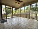 Spacious screened-in porch with tile flooring, perfect for enjoying the outdoors in comfort at 228 31St Avenue Ne Ct, Hickory, NC 28601
