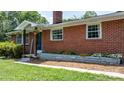 Close-up of the brickwork, front door, and landscaping at 2623 Ne 13Th Ne St, Hickory, NC 28601