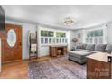 Inviting living room with hardwood floors and shuttered windows at 2623 Ne 13Th Ne St, Hickory, NC 28601