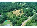Picture of the property's landscape showing its well-manicured land surrounded by lush trees at 4171 Leatherman Rd, Vale, NC 28168