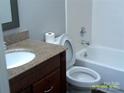 Traditional bathroom featuring tile surround and a vanity with granite countertop at 5855 Amity Springs Dr, Charlotte, NC 28212