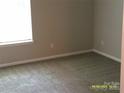 Neutral bedroom with a window for natural light, offering a calm and inviting space at 5855 Amity Springs Dr, Charlotte, NC 28212