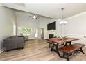 Spacious living room featuring a fireplace, vaulted ceilings, hardwood floors and comfortable seating at 8524 Loxton Cir, Charlotte, NC 28214