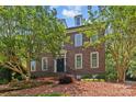 Classic brick home with elegant dormers and meticulous landscaping offers timeless curb appeal at 1019 Westlake Dr, Kannapolis, NC 28081