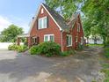 Two-story brick home with tidy landscaping and a spacious driveway at 1102 Lane St, Kannapolis, NC 28083