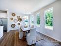 Bright dining room featuring hardwood floors, natural light and decorative wall art at 11021 Warfield Ave # 03, Huntersville, NC 28078