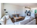 Cozy living room with comfortable seating and an open floor plan to the kitchen at 11021 Warfield Ave # 03, Huntersville, NC 28078
