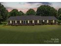 The exterior of this charming ranch home has classic brickwork and blue shutters at 1904 Old Peachland Rd, Marshville, NC 28103