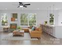 Bright living room with hardwood floors, modern furniture, and natural light at 2063 Sadler Woods Ln, Charlotte, NC 28214