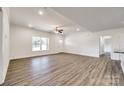 Spacious living room features light walls and flooring with recessed lights and a ceiling fan at 3248 Ferguson Long Rd, York, SC 29745