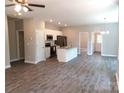 Inviting open-concept living and kitchen area with stainless steel appliances at 372 Lippard Farm Rd, Statesville, NC 28625