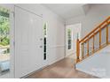 Bright foyer with hardwood floors and a staircase at 9833 White Cascade Dr, Charlotte, NC 28269