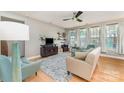 Bright living room with large windows and hardwood flooring at 133 Glade Valley Ave, Mooresville, NC 28117