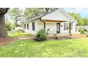 Attractive single-story house featuring well-kept lawn and traditional architecture with a welcoming front porch at 210 W Church St, Cherryville, NC 28021