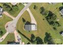Bird's-eye view of a well-maintained home with expansive green lawn, mature trees, and private driveway at 2268 Bay Ct, Newton, NC 28658
