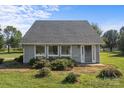 Inviting single-story home with ample natural light, a well-manicured lawn, and mature shrubs at 2268 Bay Ct, Newton, NC 28658