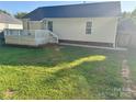 Backyard featuring a well-maintained lawn, a deck, and convenient access to the house at 2289 Kestrel Dr, Rock Hill, SC 29732