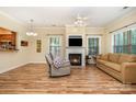 Inviting living room featuring a fireplace, hardwood floors, and natural light at 2773 Clover Nw Rd, Concord, NC 28027