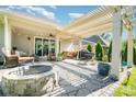 Outdoor patio space featuring a pergola, fire pit, grill and comfortable seating at 3899 Zemosa Nw Ln, Concord, NC 28027