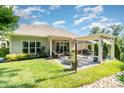 Backyard oasis with lush lawn and patio featuring a pergola and fire pit at 3899 Zemosa Nw Ln, Concord, NC 28027