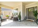 Inviting front porch with ample seating and stylish décor at 3899 Zemosa Nw Ln, Concord, NC 28027