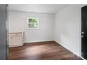 Open kitchen area with tiled backsplash, hardwood floors, and natural light, perfect for culinary creations at 405 Jones Street St, Monroe, NC 28110