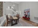 Dining room with high ceilings and staircase at 4208 Burning Tree Dr, Charlotte, NC 28277
