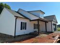 New construction of a white two-story home with a covered front porch and an attached garage, showing the exterior siding at 4940 Southview Dr, Hickory, NC 28602
