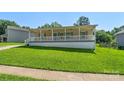 A quaint home with a welcoming front porch and lush green lawn at 5206 Crane Point Dr, Charlotte, NC 28227