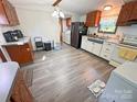 Bright kitchen with stainless steel appliances, light countertops and wood cabinets at 589 Owls Den Rd, Lincolnton, NC 28092