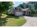 Charming home with a two-car garage and well-maintained lawn at 860 Wynnshire Dr, Hickory, NC 28601
