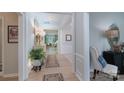 Inviting hallway with stylish decor, light wood floors, and views into the living spaces at 8637 Annabel Lee Ln, Charlotte, NC 28277