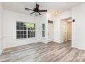 Bright living room with modern flooring and an entrance to the home's foyer at 11411 Ridge Oak Dr, Charlotte, NC 28273
