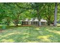 Beautiful home surrounded by lush green trees, offering a serene and private setting at 133 Pecan Ln, Salisbury, NC 28146