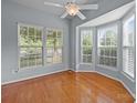 Bright bedroom featuring a bay window with natural light and hardwood flooring at 157 Talbert Town Loop, Mooresville, NC 28117
