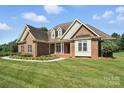 Beautiful single-Gathering home featuring manicured lawn, and a classic design at 170 Saint James Way, Salisbury, NC 28147
