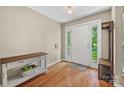 Bright foyer featuring hardwood floors and a convenient coat rack at 1921 Williford Woods Ln, Rock Hill, SC 29730
